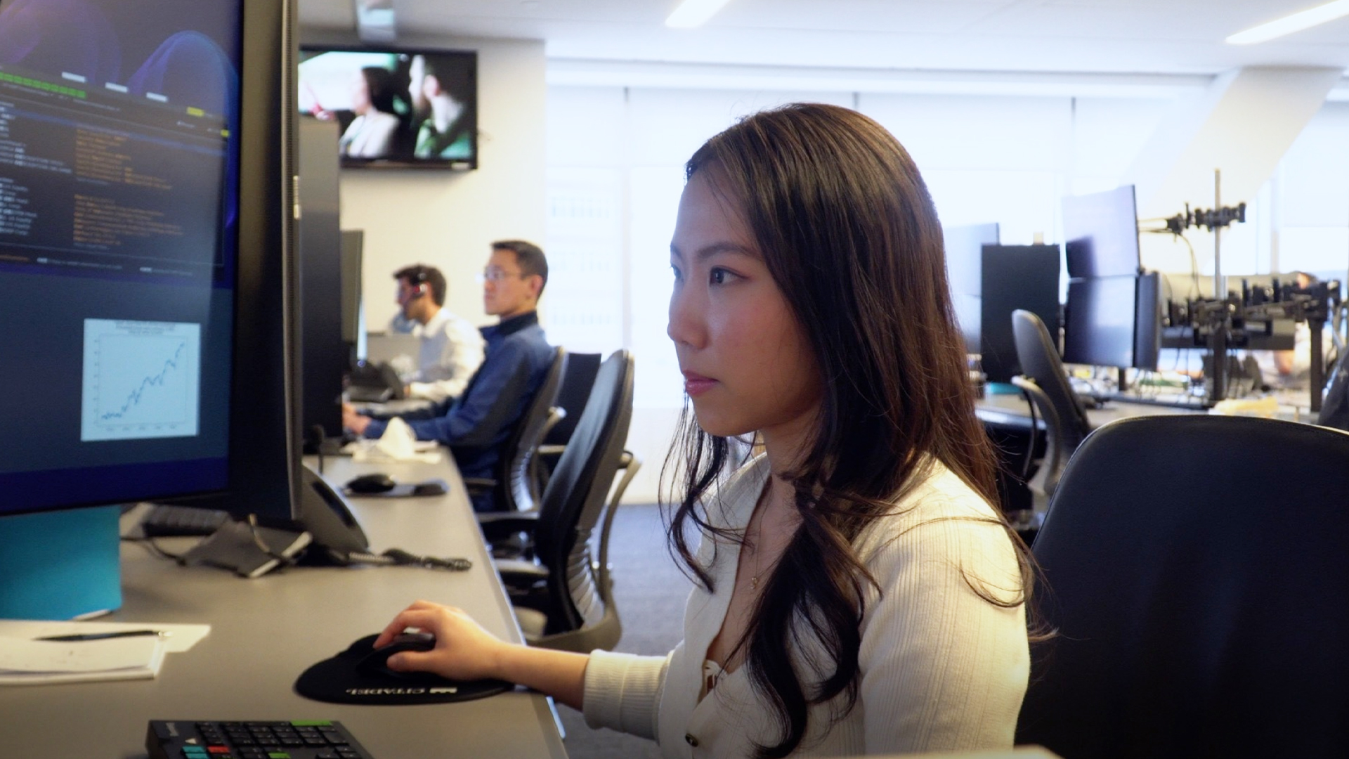 A girl sitting in front of the computer.